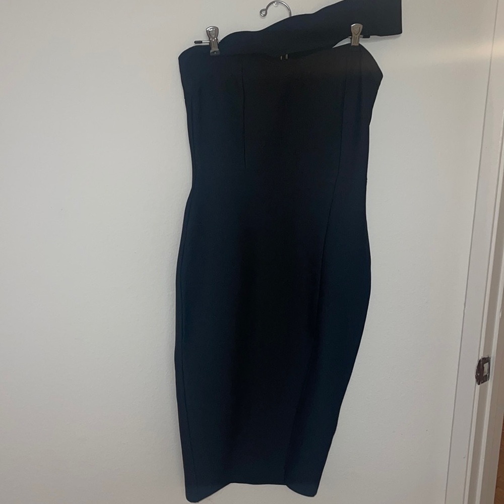Black body-con, one across body strap dress.